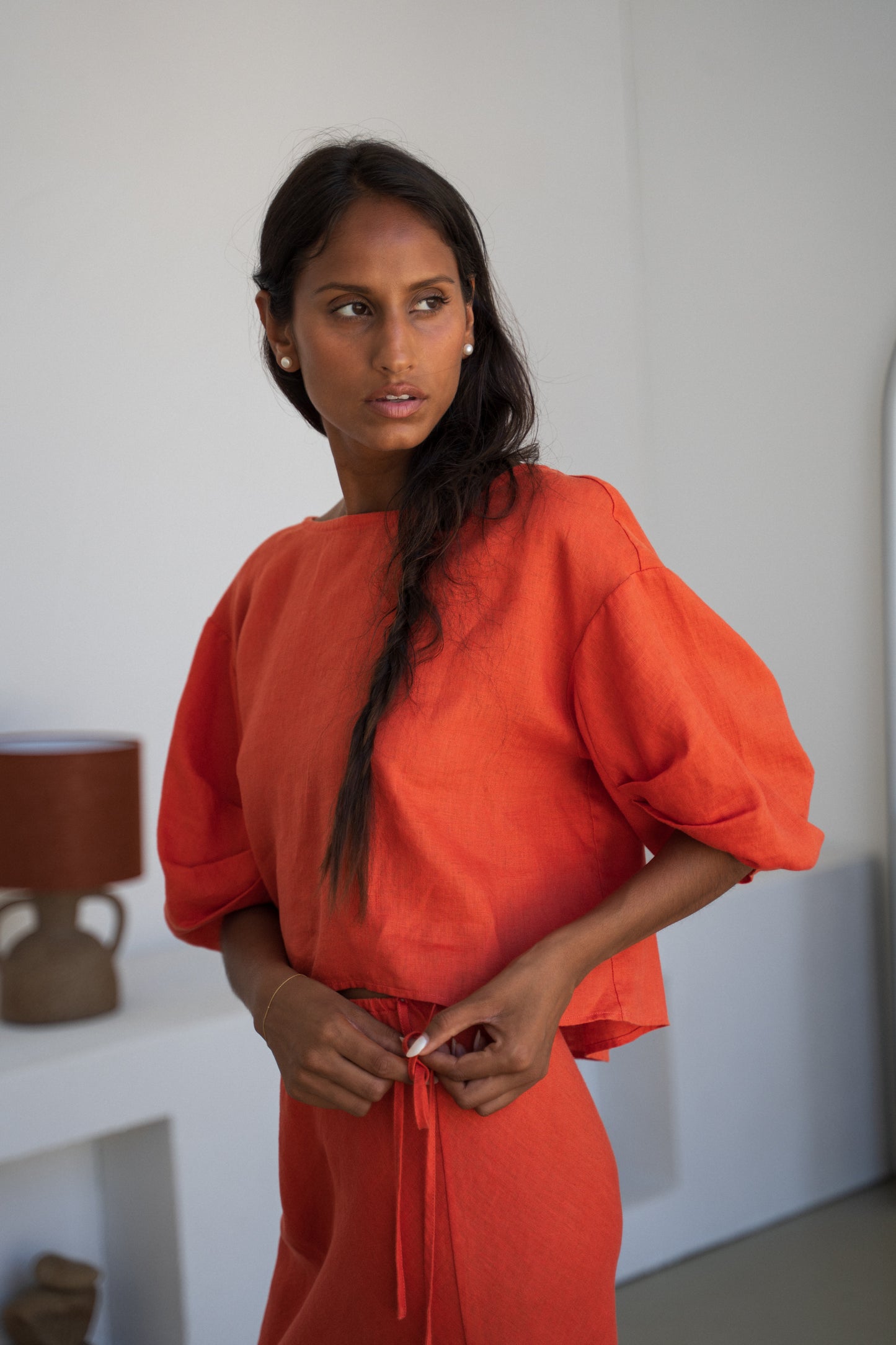 LILLY PILLY woman wearing Leia linen top in Spritz paired with Riley linen skirt